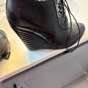 Yves Saint Laurent Black Patent & Leather Lace-Up Wedge Booties